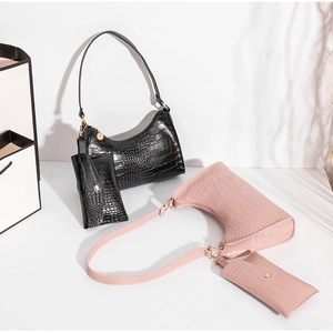 Women's faux leather crocodile embossed underarm bag with small pouch in black and pink