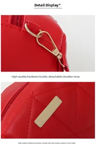 Macro view of red quilted leather handbag detail with detachable gold metal buckle hooks
