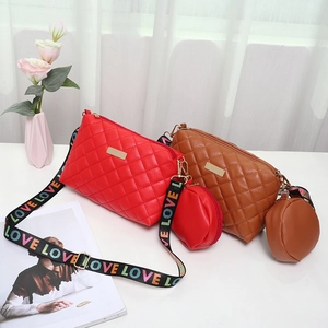 Red and brown quilted crossbody bag set with wide LOVE strap and matching coin pouch