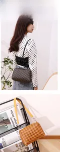 Detail of dark coffee and yellow shell shoulder bag with vintage geometric clover patterns