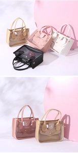 Detail showing various colors of transparent PVC handbags with leather handles and inner pouches