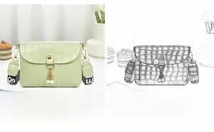 Detail of green crocodile embossed mini bag with pearl pendant and printed wide strap