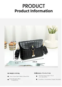 Detail of crocodile pattern mini bag with pearl chain strap and gold clasp closure
