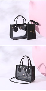 Detail of transparent PVC tote with black leather trim and matching envelope pouch bag
