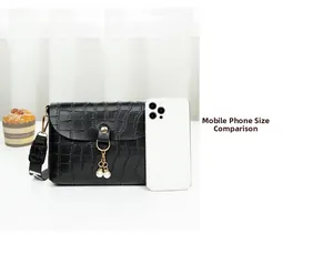 Size comparison of a black crocodile pattern mini bag with pearl tassel and smartphone