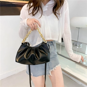 Fashionable black pleated cloud bag with thick gold chain handle and shoulder strap