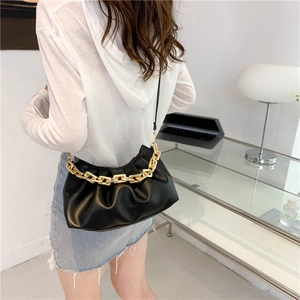 Fashionable black pleated cloud bag with chunky gold chain strap and crossbody design