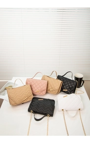 Collection of quilted crossbody bags in five colors with gold chain straps and top handles