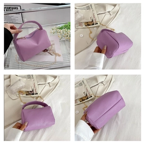 Multi-angle view of purple lychee pattern pillow handbag with gold chain strap detail