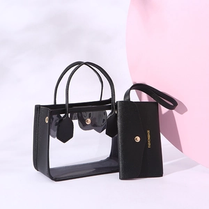 Modern transparent PVC tote bag with black inner PU pouch and stylish round handles