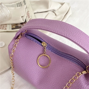 Chic purple cylinder pillow bag with lychee texture and gold chain detail