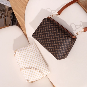 Brown and white floral patterned leather shoulder bags with gold chain and leather straps