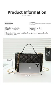 Detail of black quilted crossbody bag with gold chain strap and size comparison with phone