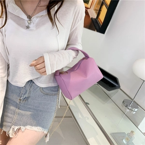 Purple litchi pattern cylinder handbag with gold chain strap for women in office setting