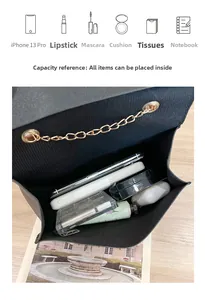 Internal view of black crossbody bag showing capacity for phone, makeup, and essentials