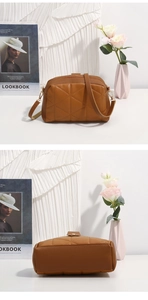 Detail of a brown quilted small square bag with triangle stitching and gold metal buckles