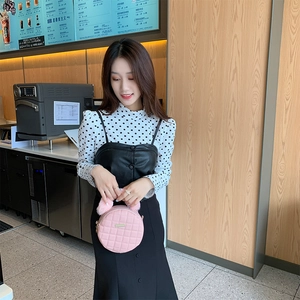 Pink quilted round chain bag for women with plush fur balls and metallic details