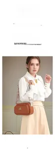 Detail of brown litchi leather square bag with KEKAKE logo and geometric wide strap