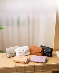 Detailed row of quilted chain crossbody bags featuring gold flower clasps in six colors