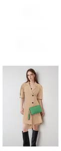 Chic lime green textured mini crossbody bag shown on a stylishly dressed model