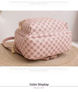 Detailed view of pink leather backpack with clover pattern and gold zippers
