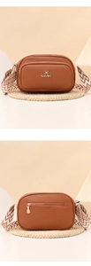Detailed view of caramel brown camera bag with jacquard strap and gold KEKAKE logo
