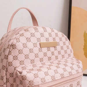 Pink mini faux leather backpack with clover print and gold logo plate for women