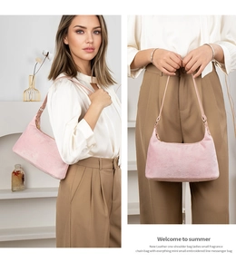 Close-up of pink suede texture on minimalist hobo bag with slim shoulder strap