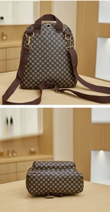 Detail view of the brown backpack rear side with adjustable straps and golden hardware