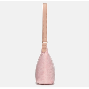 Detailed side view showing soft pink faux fur texture and leather strap of shoulder bag
