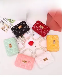 Top view of mini jelly bags with pearl handles and diamond quilting in various colors