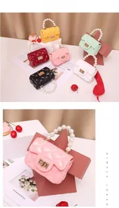 Detailed close-up of colorful mini quilted jelly bags with faux pearl handles and chain