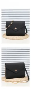Detail view of black textured leather bag with gold twist lock and chain strap