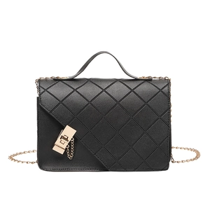 Elegant black quilted crossbody bag with gold chain strap and turn-lock closure