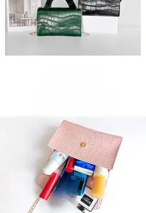 Internal view of faux crocodile handbag showing spacious interior with everyday essentials