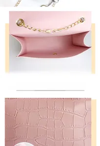 Detailed macro view of pink crocodile-embossed leather and golden chain on women's bag