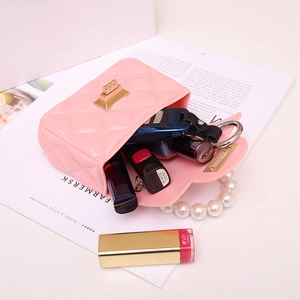 Pink quilted mini jelly bag with pearl handle and golden twist lock for daily essentials