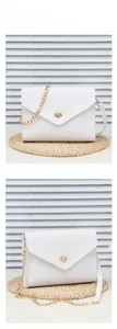 Close-up of white envelope chain bag with pebbled leather and gold twist lock
