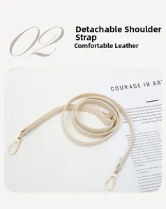 Adjustable faux leather shoulder strap with gold lobster clasp for woven camera bag