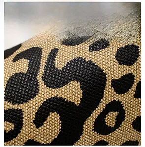 Close-up of leopard print fabric texture showing durable woven canvas material details