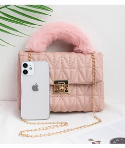 Detailed size comparison of pink quilted small bag with plush handle and gold chain strap