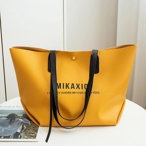 Ginger yellow leather tote bag with MIKAXIO letter print and thin black straps