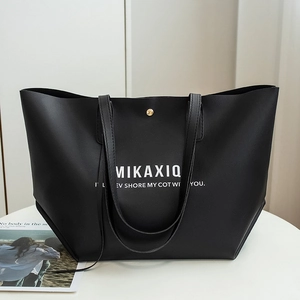 Black large capacity tote bag in matte PU leather with white MIKAXIQ lettering print