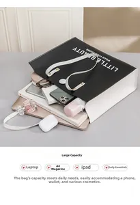 Spacious interior of tote bag holding laptop, A4 magazine, iPad, and accessories