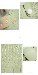 Close-up of crocodile pattern PU leather surface and metal magnetic buckle on handbag