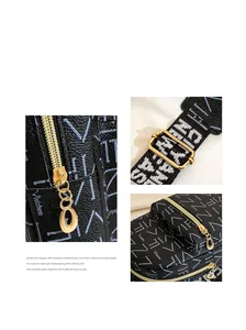 Detail of premium golden hardware and vintage letter print on black crossbody bag