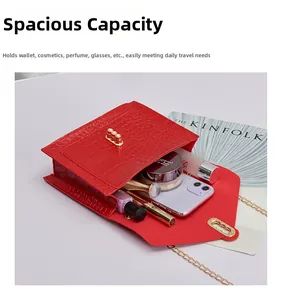 Internal view of red crocodile pattern flap bag showing space for phone and makeup