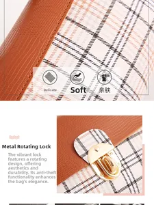 Detail of lizard texture leather and plaid fabric with golden twist lock closure