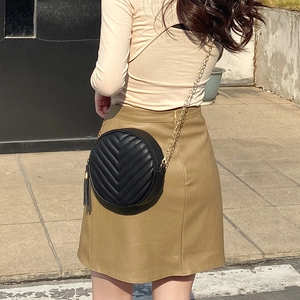 Classic black V-quilted round crossbody bag with golden chain and stylish leather tassel