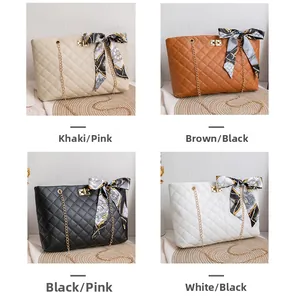 Quilted handbags in four colors with gold chains and silk scarf handles on a warm background